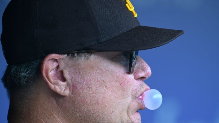 San Diego Padres manager Mike Shildt blows a bubble during...