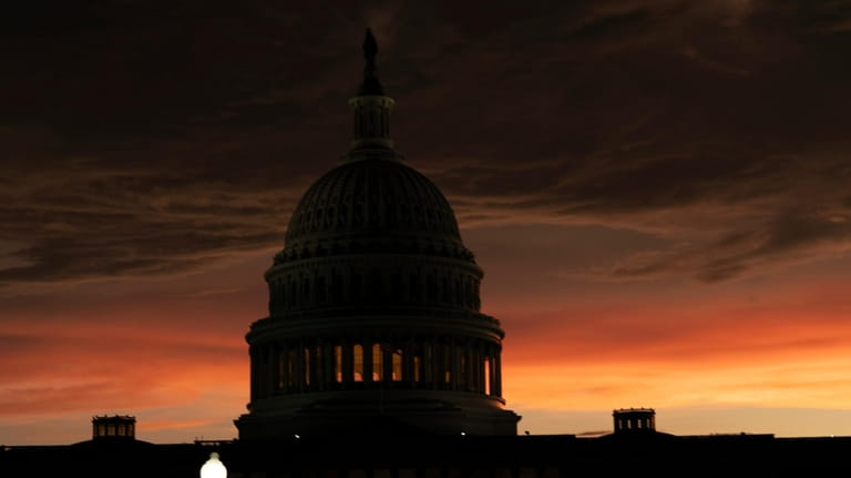 The U.S. Capitol is seen at sunset in Washington, Wednesday,...