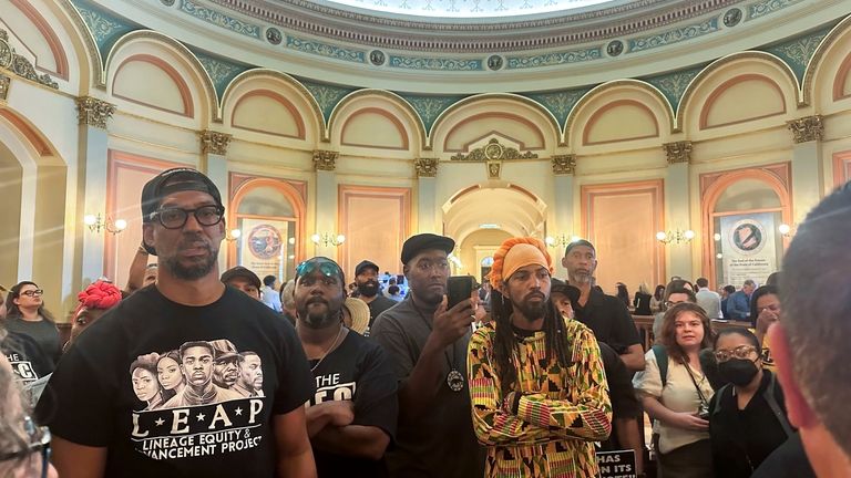 Members of Coalition for a Just and Equitable California protest...