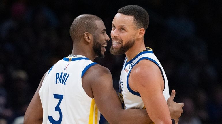 Golden State Warriors guard Stephen Curry (30) and teammate Chris...