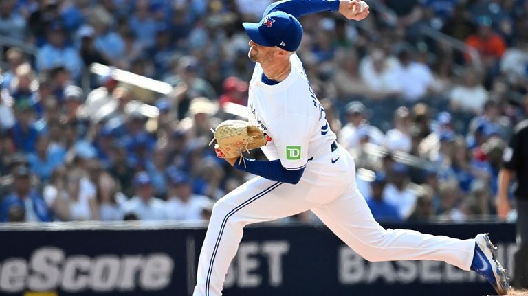 Toronto Blue Jays relief pitcher Trevor Richards (33) throws to...