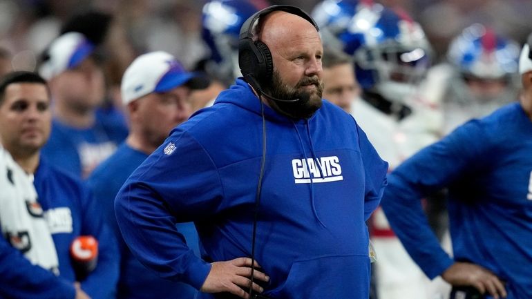 Giants head coach Brian Daboll watches during the first half...