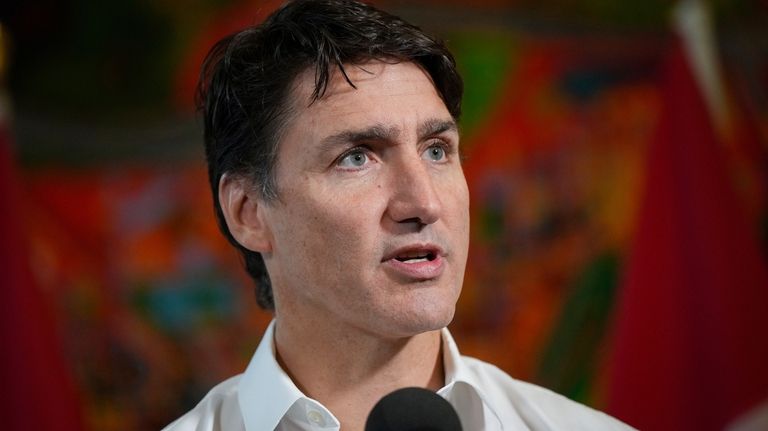 Canada Prime Minister Justin Trudeau speaks to reporters at the...