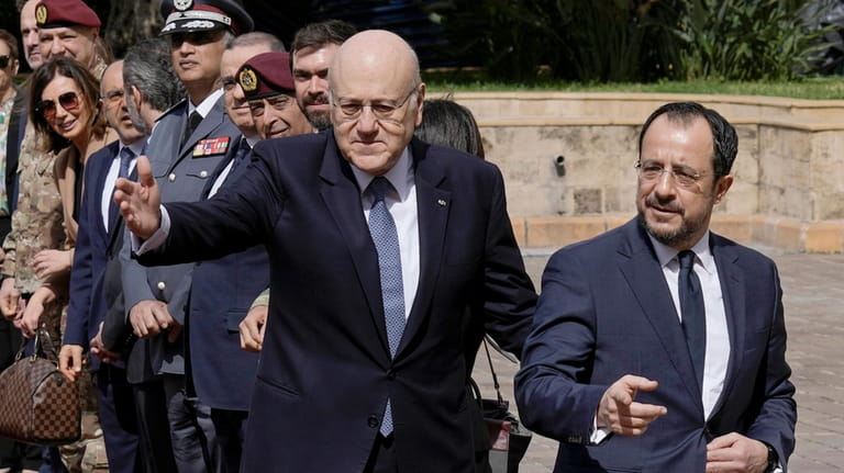 Cyprus' President Nikos Christodoulides, right, and Lebanese caretaker Prime Minister...