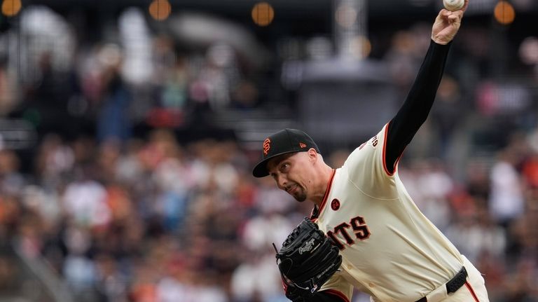 San Francisco Giants pitcher Blake Snell throws to a Colorado...