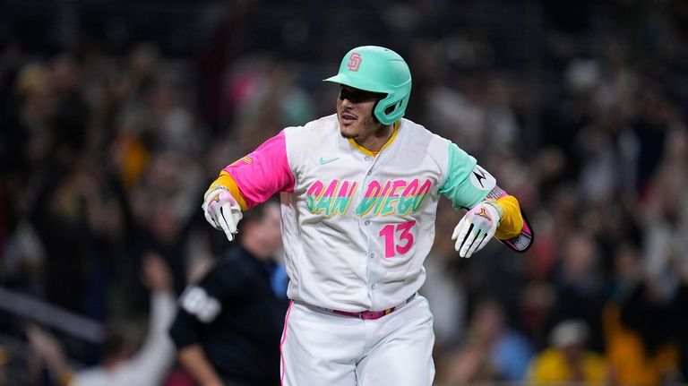 San Diego Padres' Manny Machado celebrates after hitting a two-run...