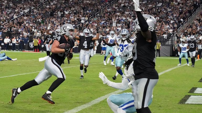 Las Vegas Raiders tight end Harrison Bryant (84) scores a...