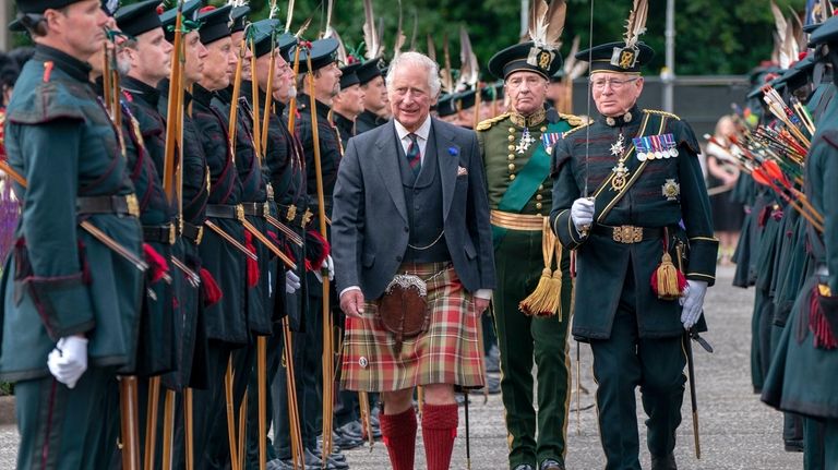 Britain's King Charles III inspects the Royal Company of Archers...