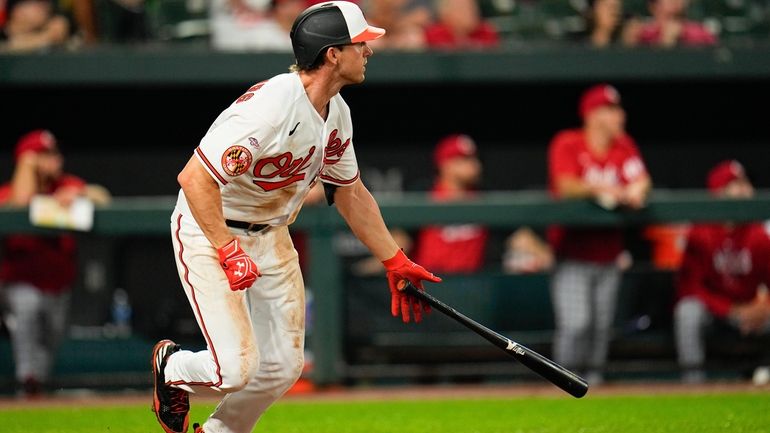 Baltimore Orioles' Jordan Westburg watches his ball after connecting for...