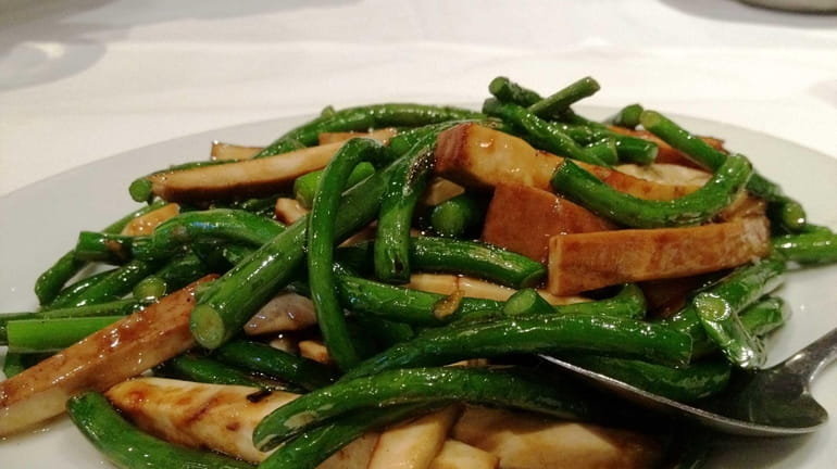 At The Orient in Bethpage, garlic stems are stir fried...