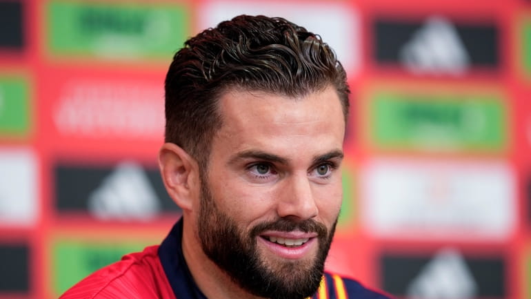 Spain's Nacho attends a press conference ahead of Sunday's Euro...