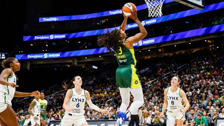 Seattle Storm's Nneka Ogwumike scores against Minnesota Lynx in the...