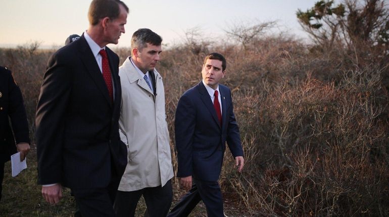 From left, Suffolk Police Chief of Department Stuart Cameron, Det....