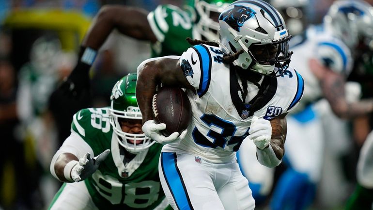 Carolina Panthers running back Mike Boone (34) runs against New...