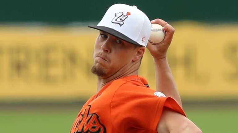 Ducks starting pitcher John Brownell #7 delivers a pitch during...