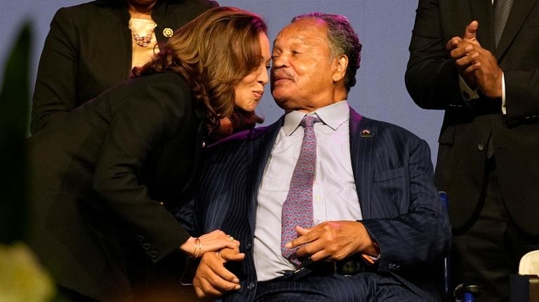 Vice President Kamala Harris, left, greets Rev. Jesse Jackson before...