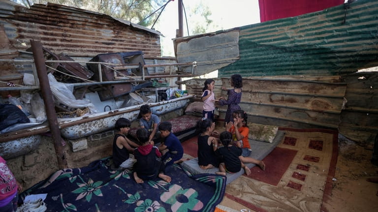 Palestinian children play in Khan Younis, Gaza Strip, Monday, June...