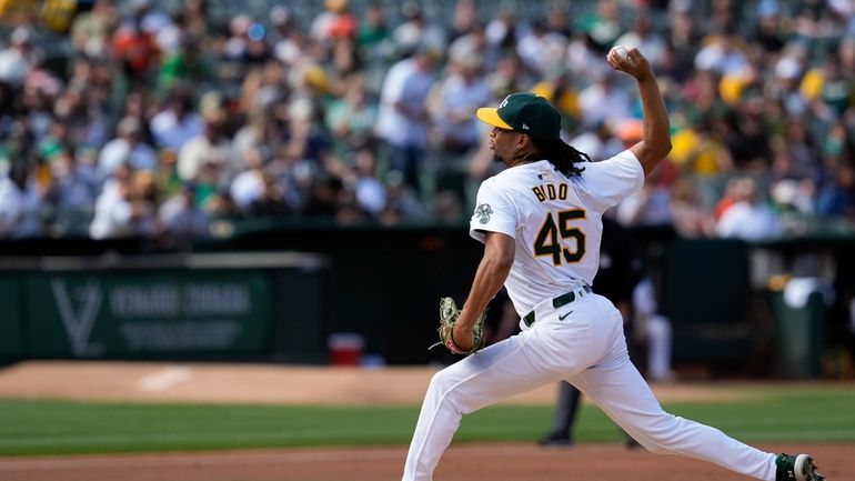 Oakland Athletics' Osvaldo Bido pitches to a San Francisco Giants...