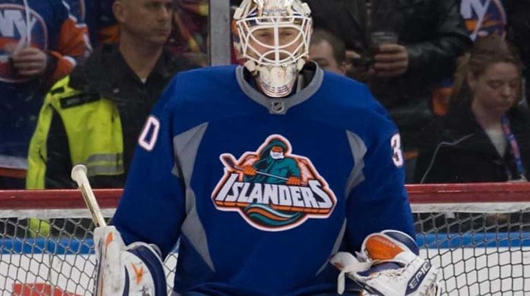 Goalie Chad Johnson wears the Islanders' "Fisherman" jersey on Feb....