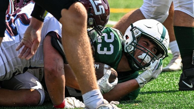 Aidan Russo of Locust Valley holds tight to the ball...