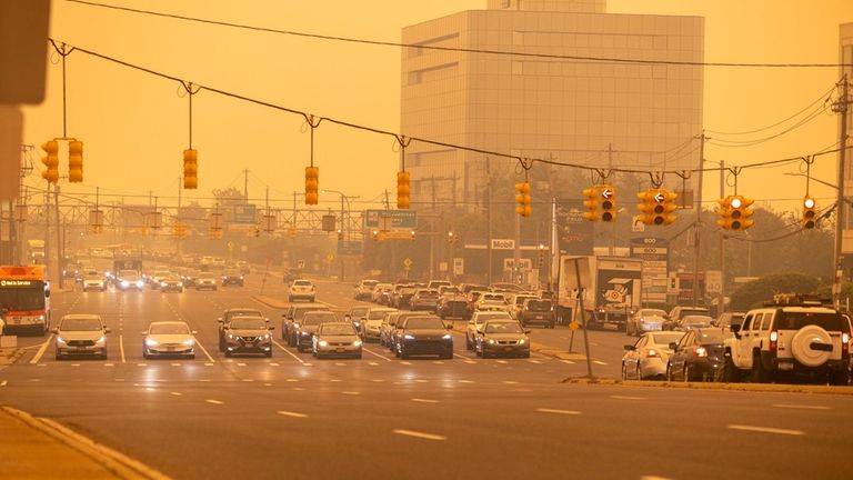 Smoke and haze moves in and covers Old Country Road...