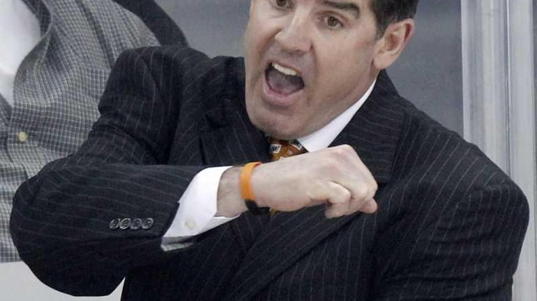 Philadelphia Flyers coach Peter Laviolette gestures to a referee during...