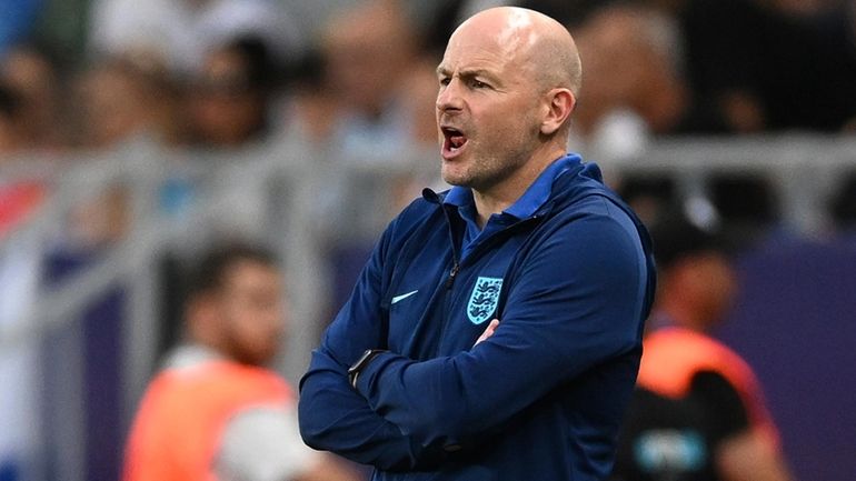 England's head coach Lee Carsley directs his players during the...