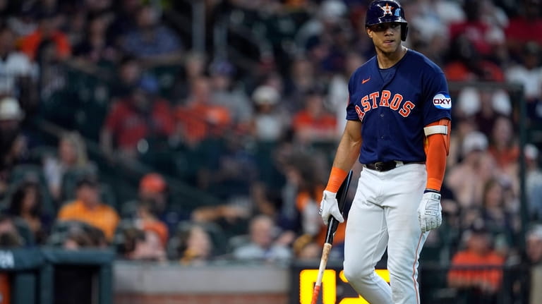 Houston Astros' Jeremy Peña walks back to the dugout after...