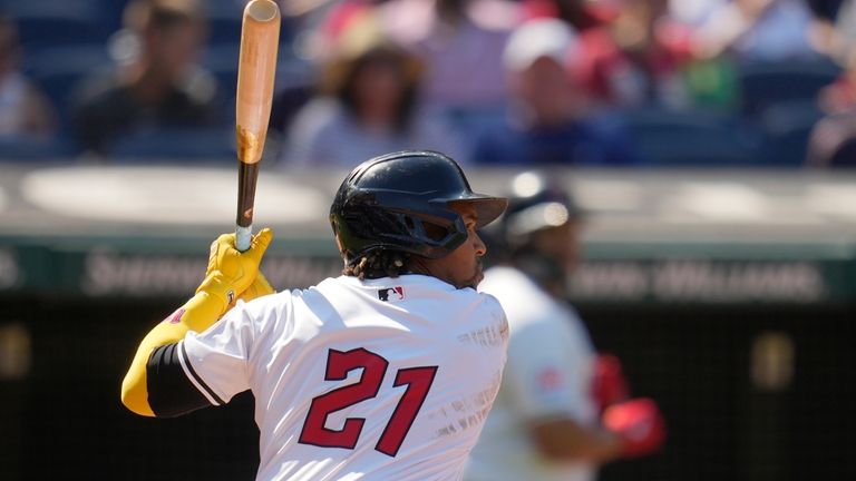 Cleveland Guardians' Jose Ramirez, wearing No. 21 on Roberto Clemente...