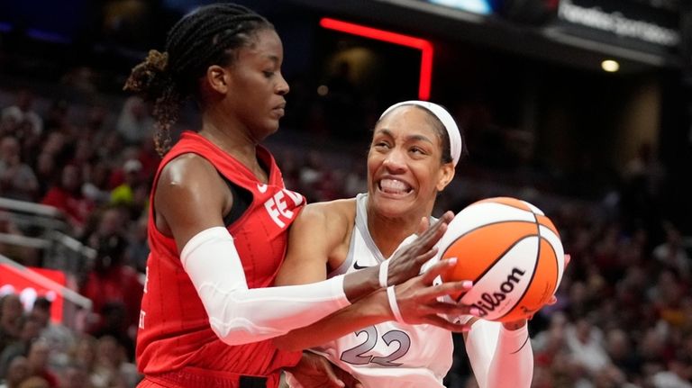 Las Vegas Aces' A'ja Wilson (22) goes to the basket...