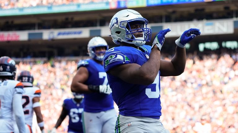 Seattle Seahawks running back Kenneth Walker III (9) reacts after...