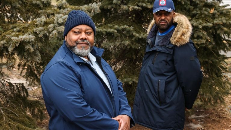 Residents E. James Freeman, left, and John Thomas visit Granny Road...