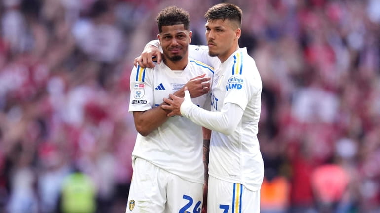 Leeds United's Georginio Rutter, left, and Joel Piroe after being...