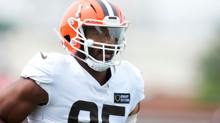 Cleveland Browns' Myles Garrett looks on during a joint NFL...