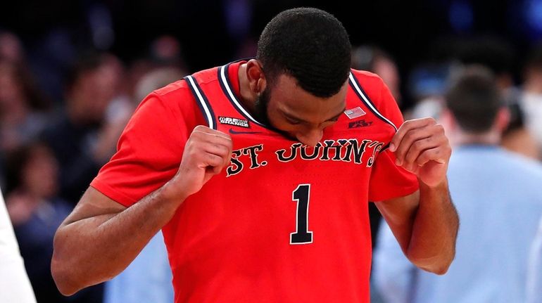 St. John's forward Aaron Wheeler reacts after losing to Villanova...