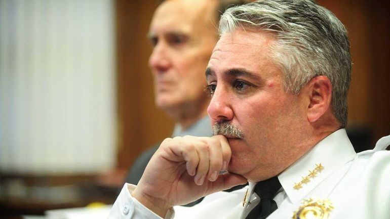 Suffolk County Police Chief of Department James Burke, front, and...