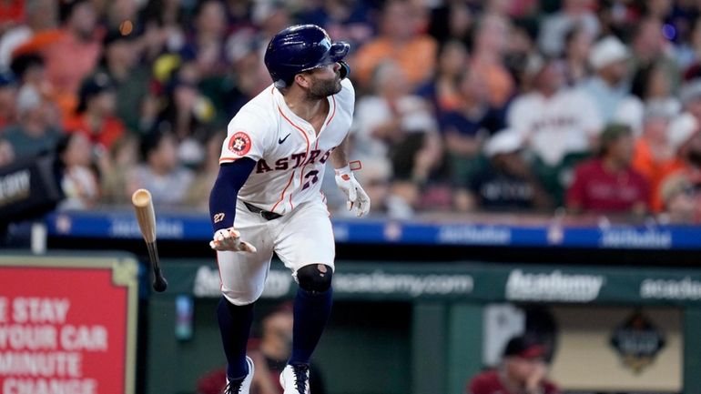 Houston Astros' Jose Altuve watches his solo home run against...