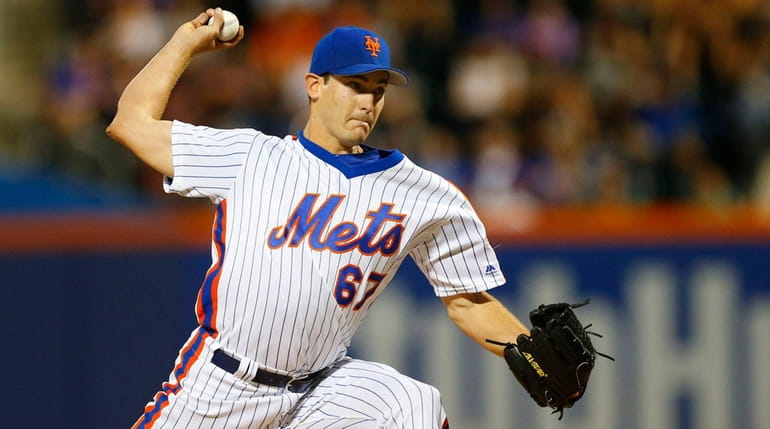 Seth Lugo of the New York Mets pitches in the...