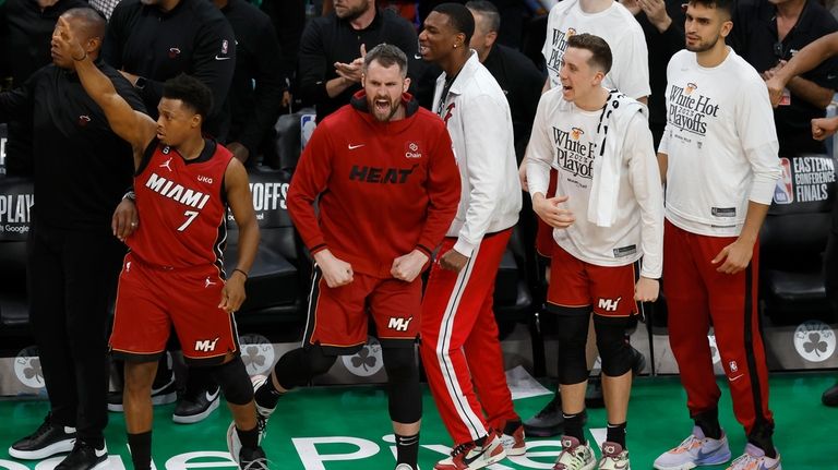 Miami Heat guard Kyle Lowry (7), forward Kevin Love, second...