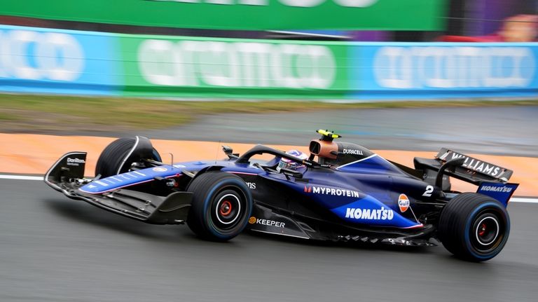 Williams driver Logan Sargeant of the US steers his car...