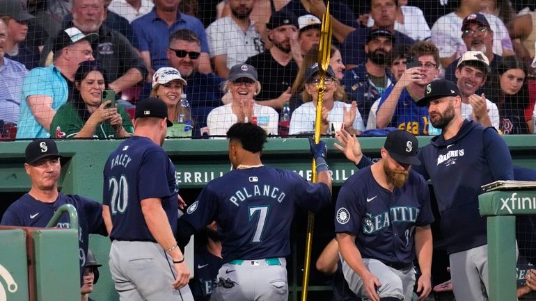 Seattle Mariners' Jorge Polanco (7) celebrates after his solo home...