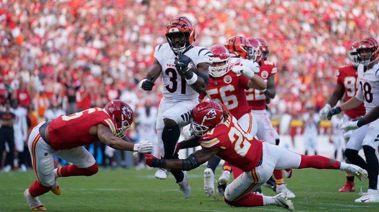 Cincinnati Bengals Zack Moss (31) runs with the ball as...