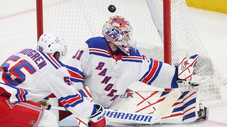 New York Rangers goaltender Igor Shesterkin (31) makes a save...