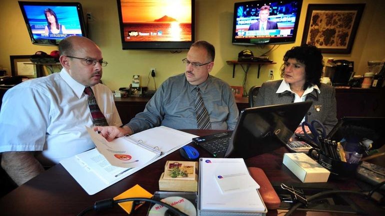 From left, Walter Kowalczyk, Steve Kuhr and Terri Kuhr of...