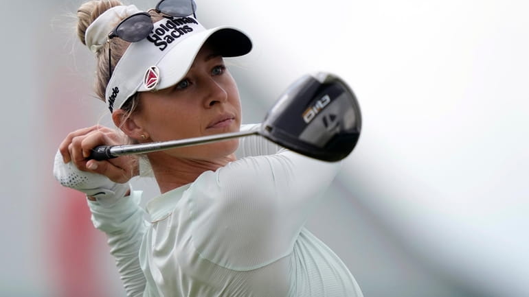 Nelly Korda watches her shot on the first hole during...
