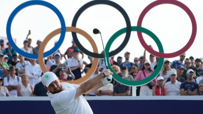 Shane Lowry, of Ireland, hits his tee shot on the...