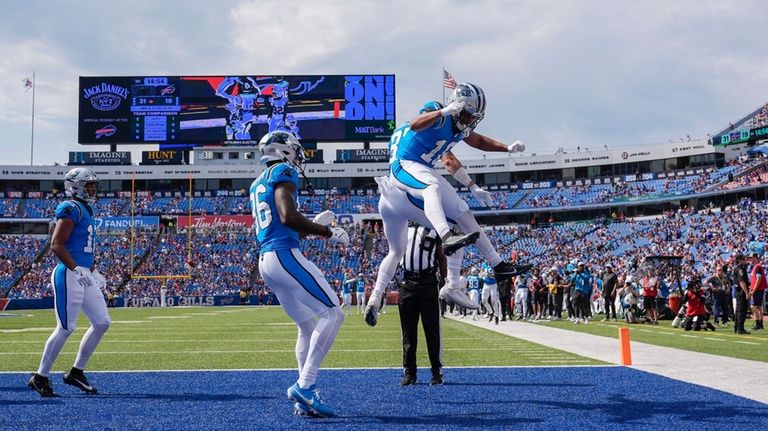 Carolina Panthers wide receiver Jalen Coker celebrates his touchdown in...