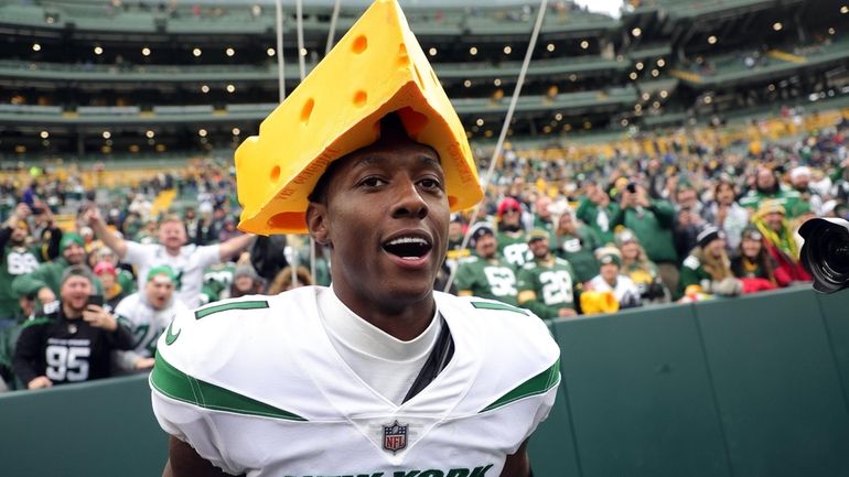 Jets rookie cornerback Sauce Gardner wears a cheesehead  after the Jets...