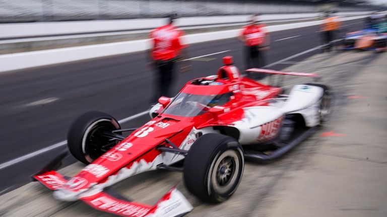 Marcus Ericsson, of Sweden, leaves the pit area during an...