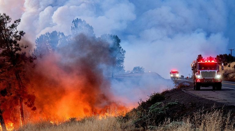 The Park Fire burns along Highway 32 in the Forest...